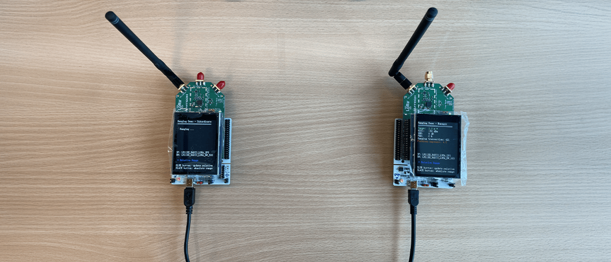 Semtech LoRa-enabled walkie-talkie devices featuring Murata 2GT module with LR1121 chip, showing both sub-GHz model with large antenna and 2.4 GHz model with compact antenna, demonstrating real-time voice communication capabilities at Electronica India 2025